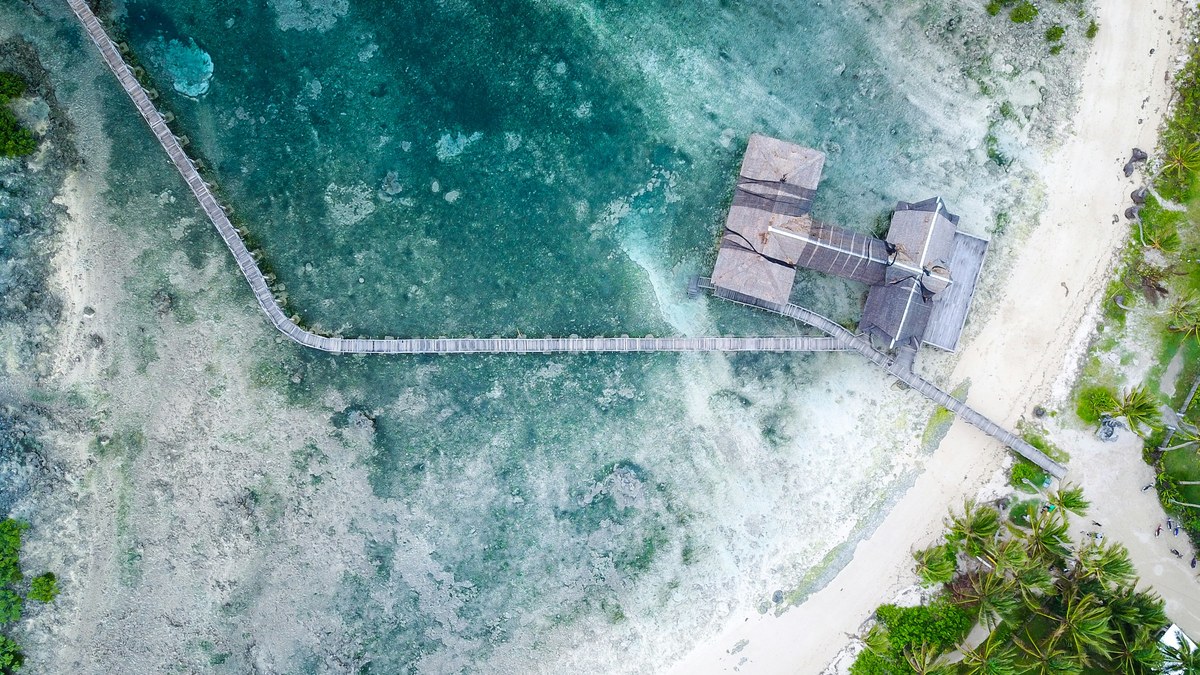 Aerial view of the Cloud 9 boardwalk and reef break in General Luna, Siargao Island